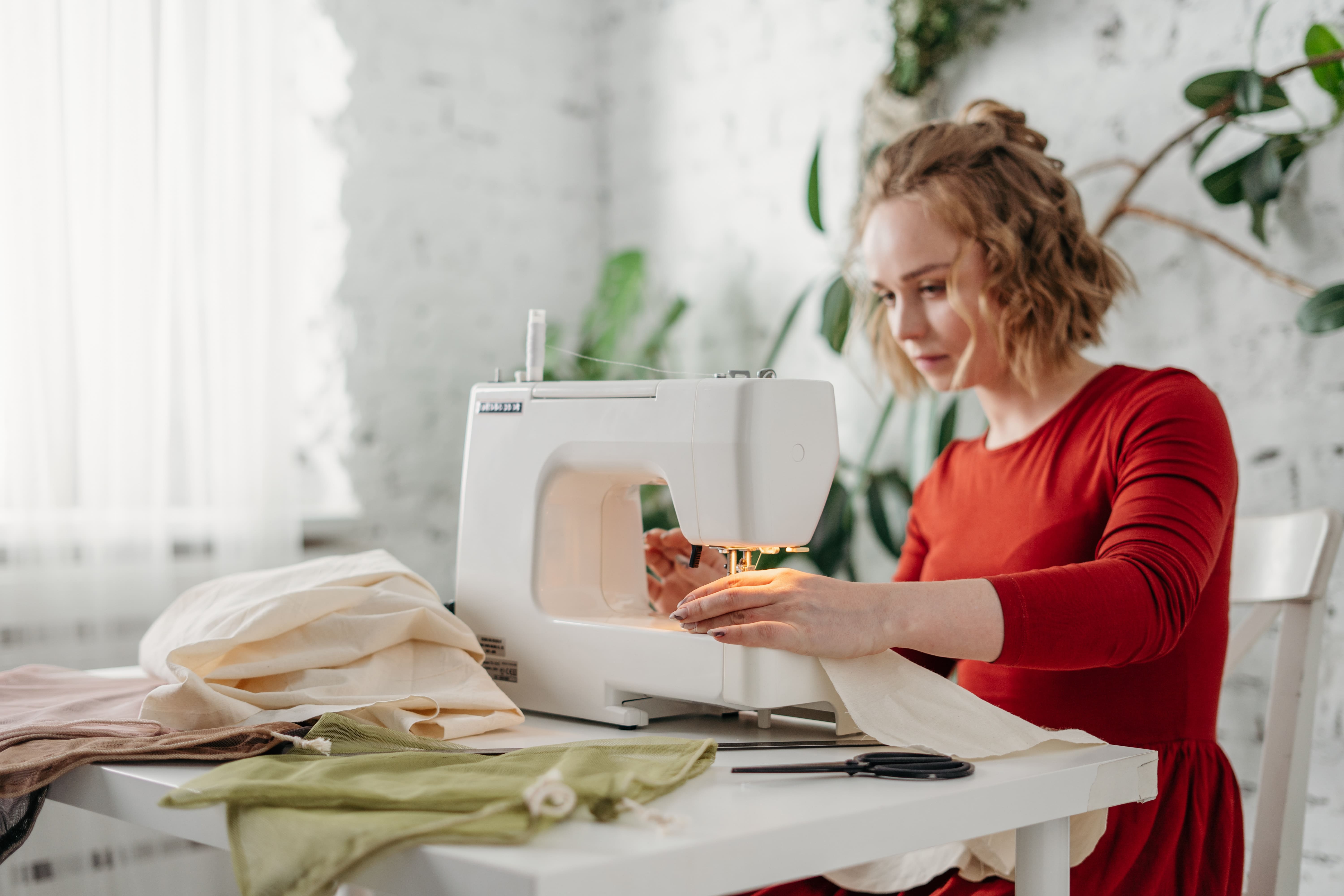 Woman sewing at home